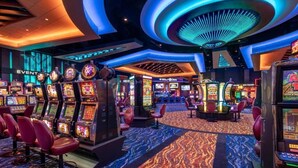 A casino interior with slot machines, red chairs, and a patterned carpet. - CDA Lake-Kayaks-Hot Tub-Boat Slip & More! (Worley)