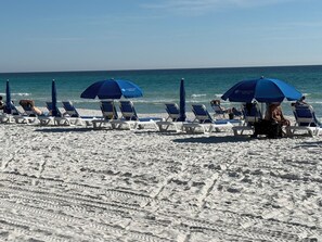 On the beach, sun loungers, beach towels