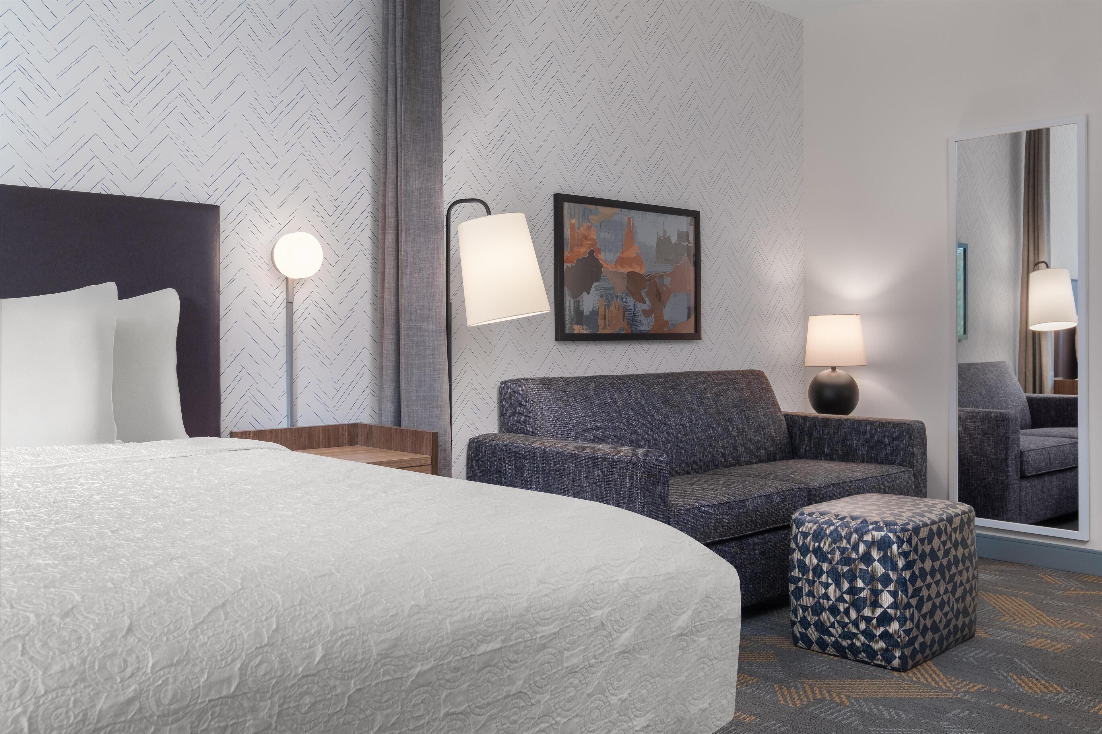 Hypo-allergenic bedding, desk, laptop workspace, blackout curtains