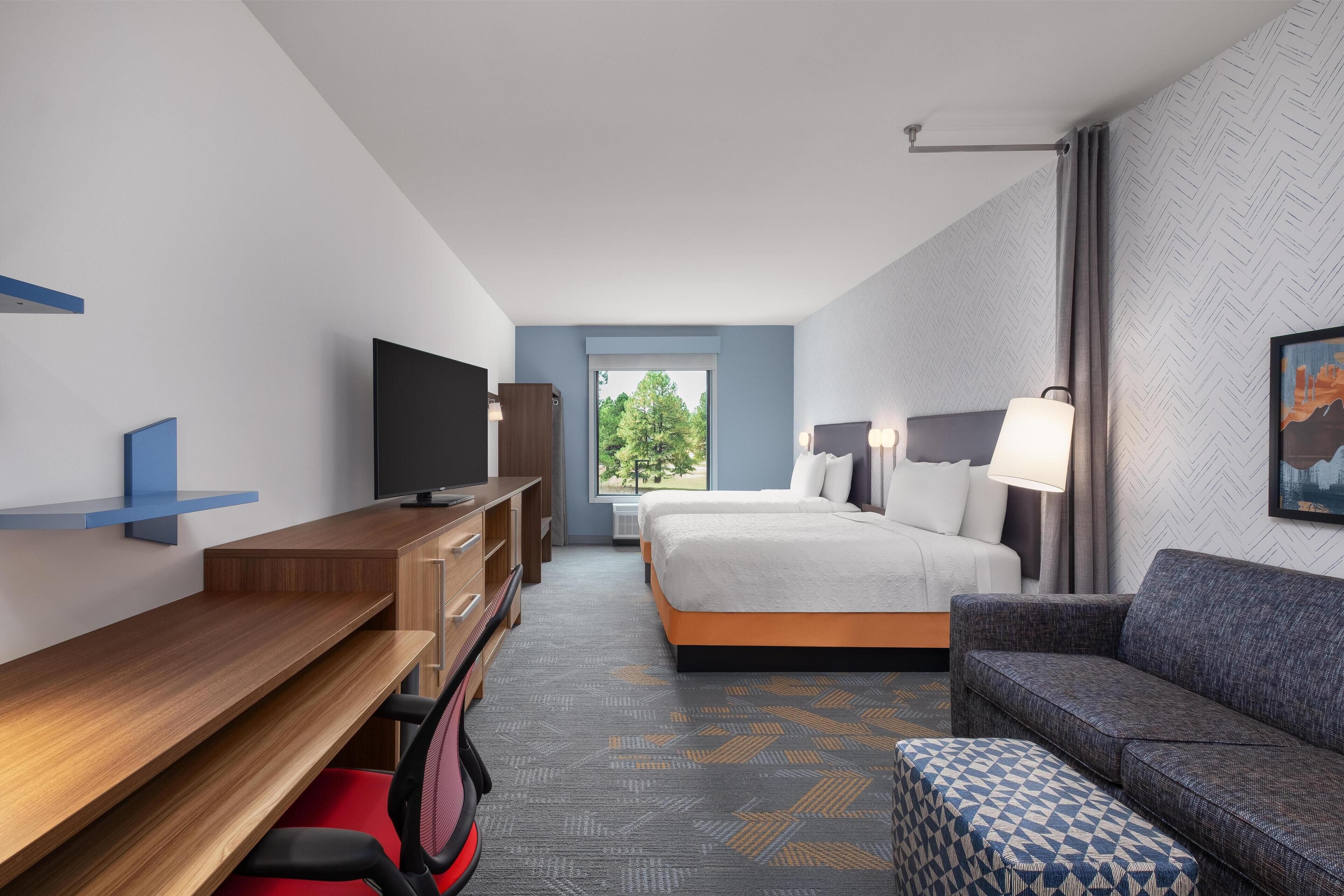 Hypo-allergenic bedding, desk, laptop workspace, blackout curtains