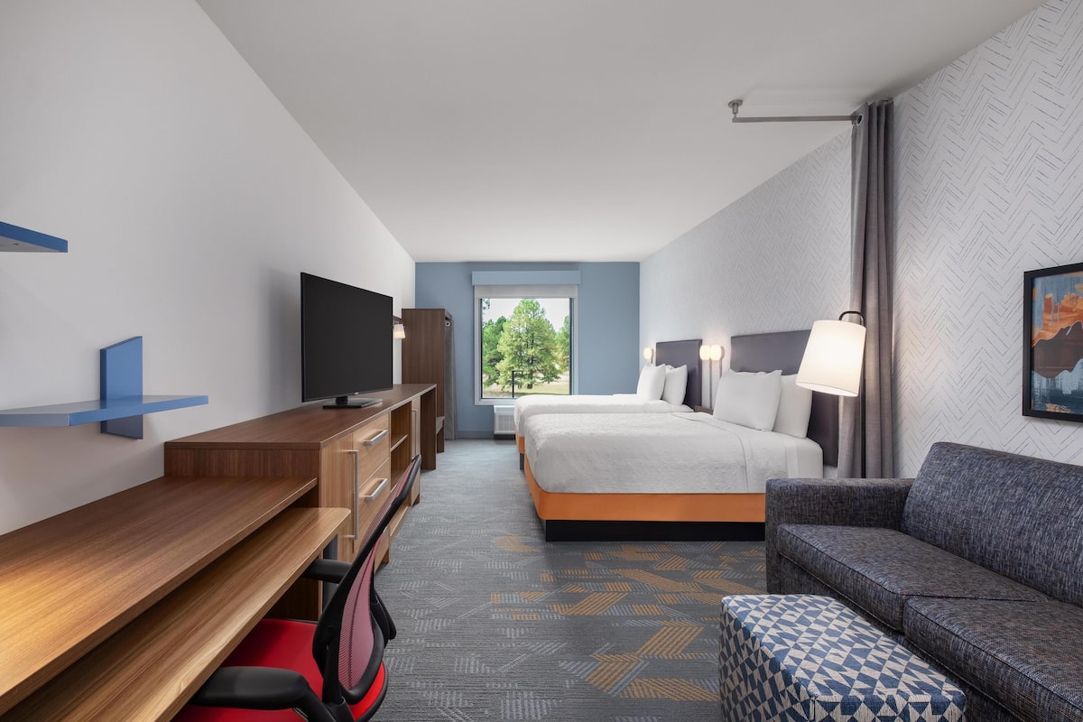 Hypo-allergenic bedding, desk, laptop workspace, blackout curtains