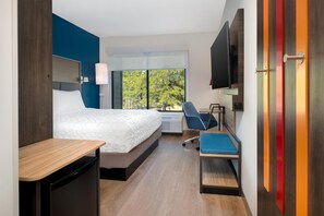 Hypo-allergenic bedding, desk, laptop workspace, blackout curtains