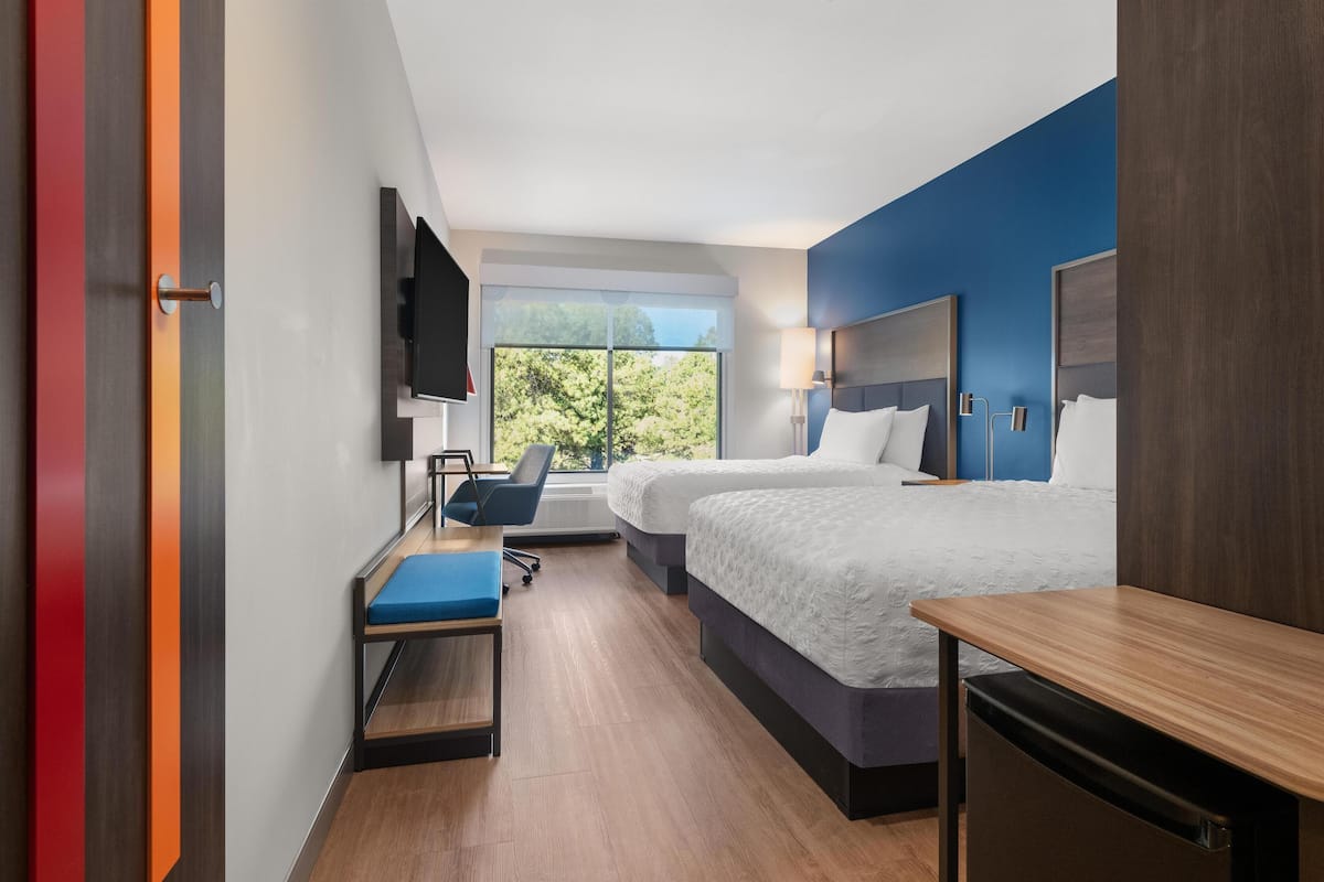 Hypo-allergenic bedding, desk, laptop workspace, blackout curtains