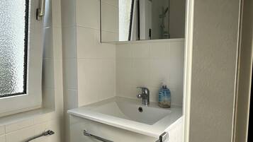 Shower, towels, soap, toilet paper