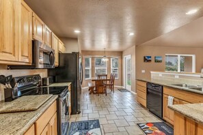 Fridge, microwave, oven, stovetop - The Gathering Place: Quiet neighborhood, 5+ Bed/3 Bath home accommodates 12. (Canon City)