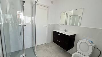 Shower, towels, soap, toilet paper