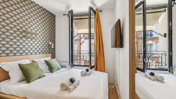 1 bedroom, desk, iron/ironing board, travel crib