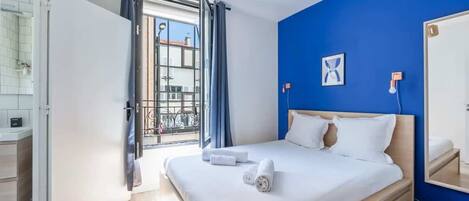 1 bedroom, desk, iron/ironing board, travel crib