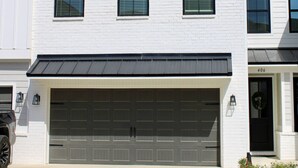 A two-story house with a white exterior, a garage, and a driveway. - Luxurious Property in the Heart of Oxford (Oxford)