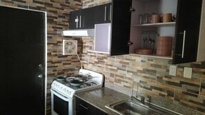 Fridge, high chair, cookware/dishes/utensils