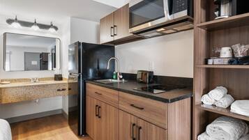 Full-size fridge, microwave, stovetop, coffee/tea maker