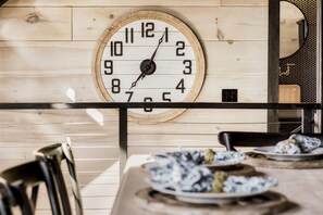 A wooden wall with a round clock and a mirror. - Million $ View|Indr Pool|Games|Pool Table|Theater (Sevierville)