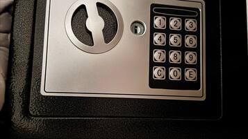A black and silver electronic keypad lock on a door.