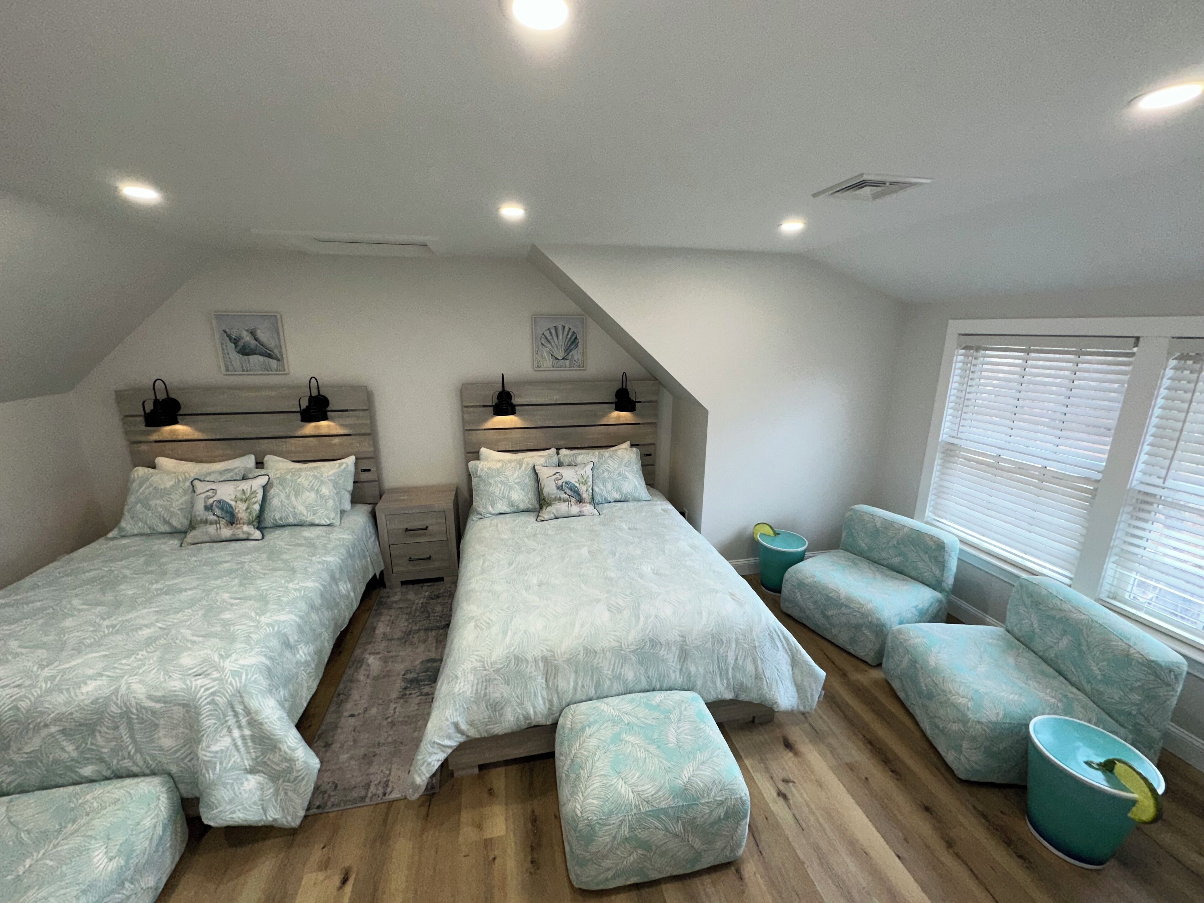 Spacious room with two queen-sized bed featuring brand new Beautyrest mattresses