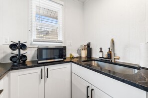Fridge, microwave, coffee/tea maker, high chair