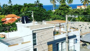 A modern multi-story building with a flat roof, large windows, and a gated entrance. - Cape Coral 1 (Cabrera)