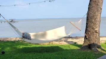 On the beach, sun-loungers