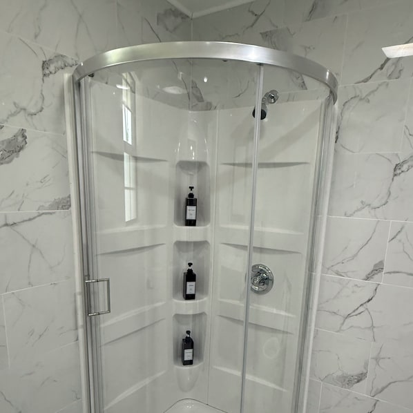 Shower, hair dryer, towels, soap