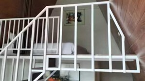 A staircase with white railings leading to a second-floor area. - The central lovina hotel & restaurant (Buleleng)