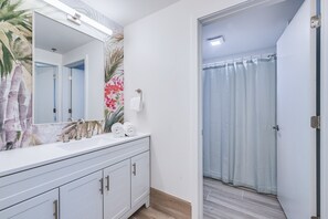 Shower, hair dryer, towels, toilet paper