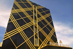 A modern building with a geometric facade and the name "PAHIR HOTEL" visible. - Fahira Hotel Syariah Padang (Padang)