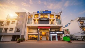 A modern hotel with a prominent 'fabHOTELS' sign, 'HOTEL EMINENT' branding, and a staircase leading to the entrance. - Fabhotel Eminent (Bhopal)