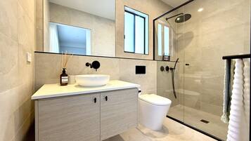 Shower, hair dryer, towels, soap