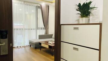 Standard Apartment, Courtyard View | Living area | 45-inch LCD TV with cable channels