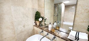 Shower, hair dryer, towels, soap