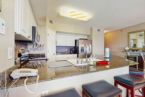 Fridge, microwave, oven, stovetop - Beachfront condo with shared pool, outdoor shower, and beach access (Gulf Shores)