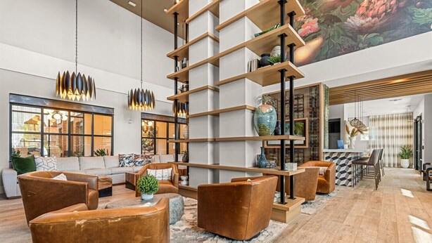 A spacious living area with a modern sofa set, a coffee table, and a decorative vase. - The Garden Luxe Retreat (Winter Garden)