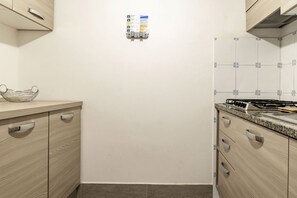 Fridge, stovetop, dishwasher, coffee/tea maker