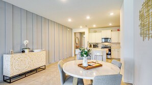 A modern kitchen with white cabinets, a microwave, and a stainless steel oven. - 7 Mi to European Village: Pond-Front Townhome! (Palm Coast)