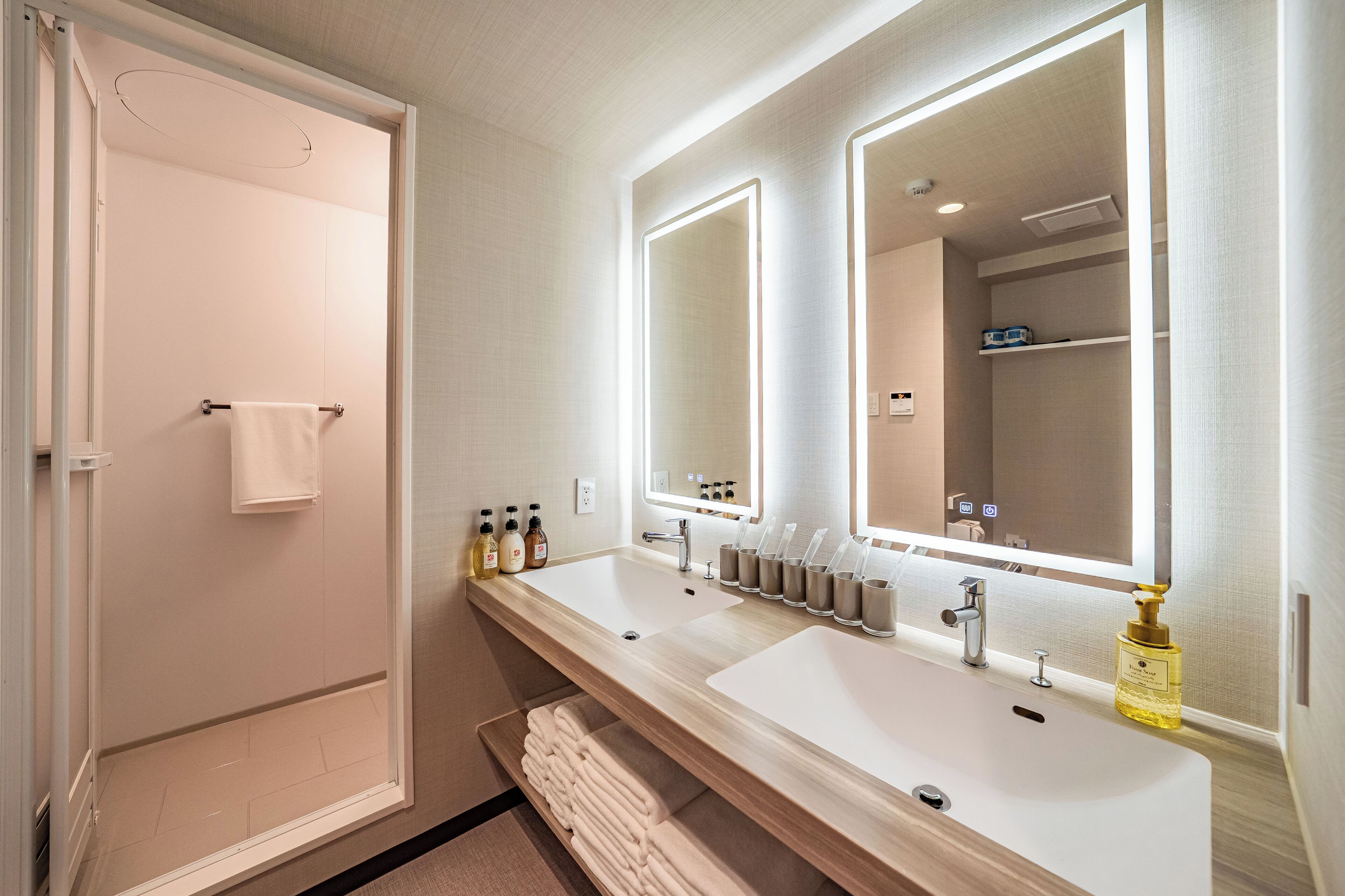 Shower, hair dryer, towels, shampoo