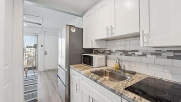 Fridge, microwave, stovetop, coffee/tea maker