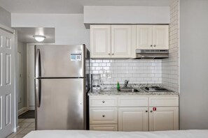 Fridge, microwave, coffee/tea maker, cookware/dishes/utensils