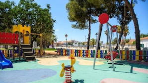 A playground with a slide, climbing structures, and a spring-mounted toy. - Artesol in Platja de l Arenal (Els Poblets)