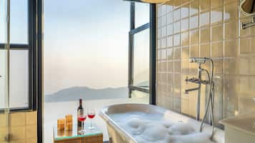 Charlotte Tree House Duplex | Bathroom | Slippers, bidet, towels