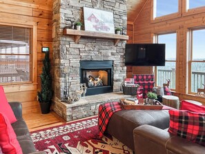 Cabin, 4 Bedrooms, Balcony, Mountain View | Living area | Books - 3 Kings 4 Bunks-sleeps 10-smart TV X6-parking out Front-full Kitchen-hot Tub (Mars Hill)