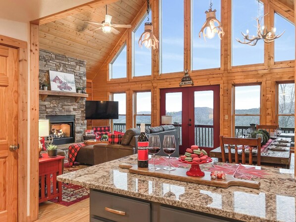 Cabin, 4 Bedrooms, Balcony, Mountain View | Living area | Books - 3 Kings 4 Bunks-sleeps 10-smart TV X6-parking out Front-full Kitchen-hot Tub (Mars Hill)