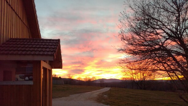 A wooden building with a gravel path leading to a grassy area. - Gîte 'Les Ursules', sleeps 2 to 6 (Le Barboux)