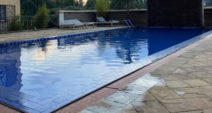 Cozy 1BR Retreat with Pool, Gym & WiFi in Leafy Serene Kitisuru, Nairobi
