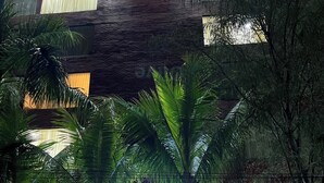 A building with a sign reading 'Olive Serviced Apartments' and a balcony with a railing. - Olive Service Apartments - HICC Hitex Hyderabad (Hyderabad)