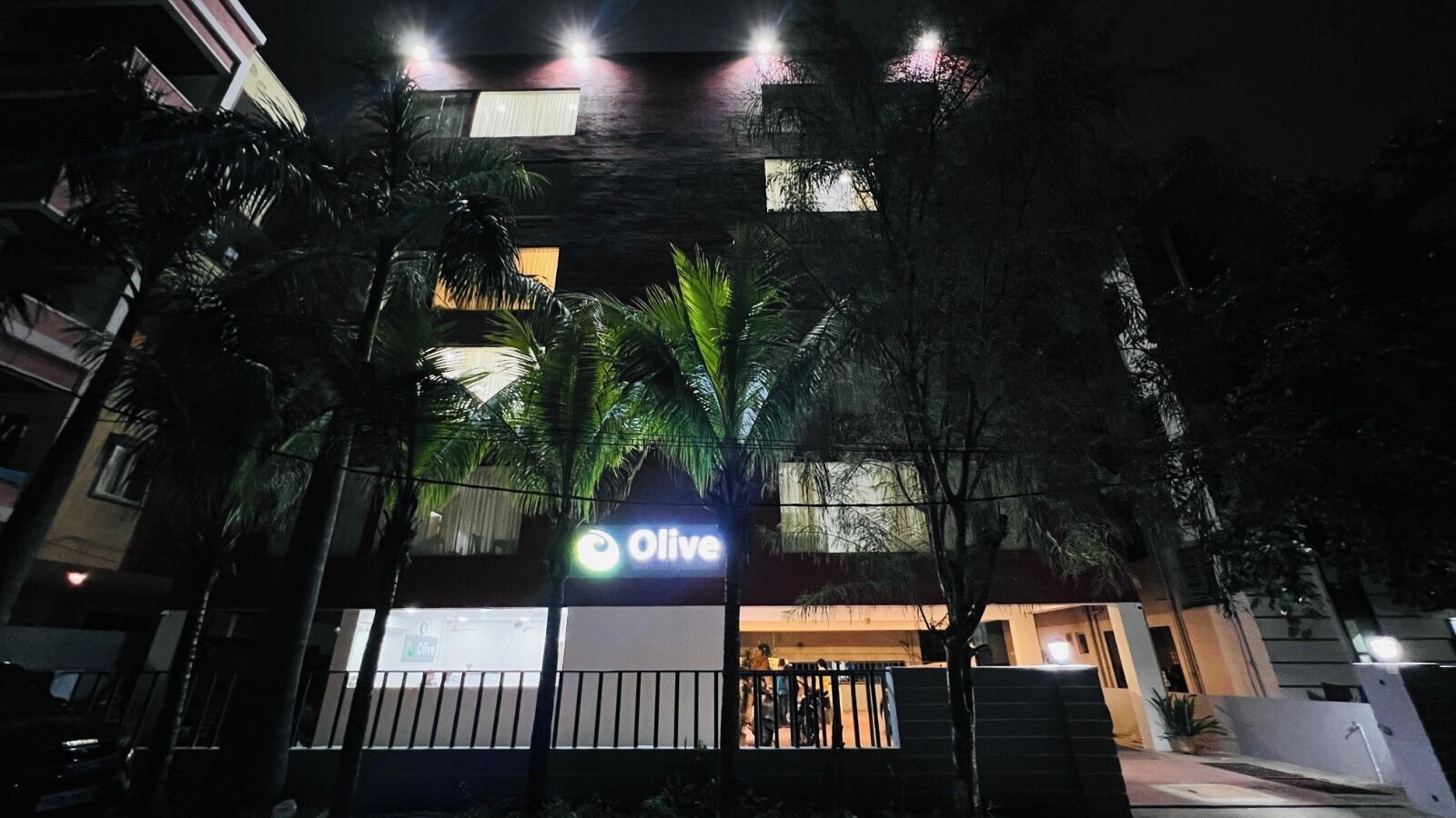 A building with a sign that reads 'Olive.'