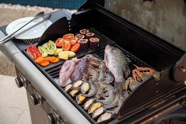 A grill with seafood and vegetables. - Andaman Pool Villas, Maikhao Beach Phuket (Mai Khao)