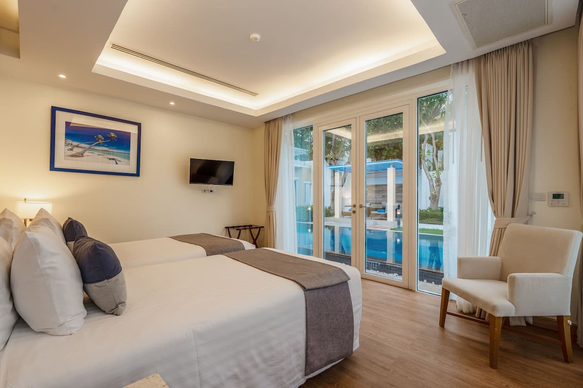 2 Bedroom Oceanfront Pool Villa | 2 bedrooms, in-room safe, desk, blackout drapes