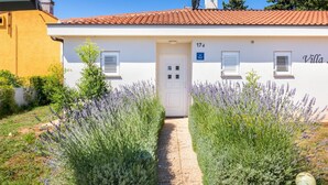 A villa with a white exterior, red-tiled roof, and a number '17' on the door. - Villa Ziziphus - Private Pool with Jacuzzi (Premantura)
