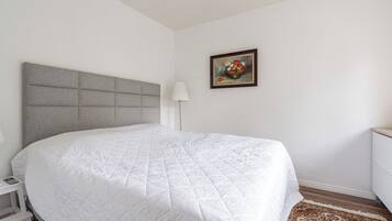 Superior Apartment, 1 Bedroom, Courtyard View, Ground Floor | 1 bedroom, desk, laptop workspace, iron/ironing board