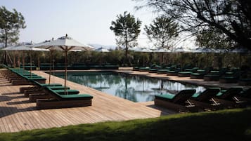 Seasonal outdoor pool, pool umbrellas, pool loungers