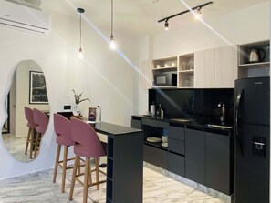 Fridge, microwave, stovetop, coffee/tea maker